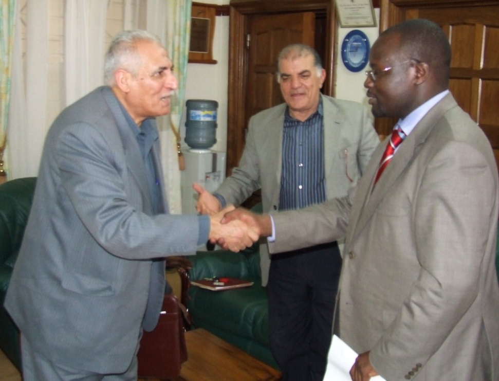 Prof. Baryamureeba(R) greets Dr. Mostafa Elgoahby(L) as Prof. M. El-Badawi(C) looks on