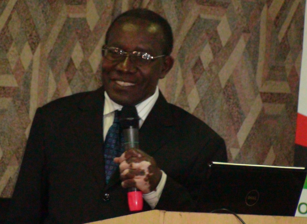 Dr. Joshua Tugumisirize delivers his presentation