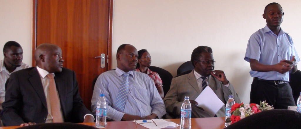 L-R Al Hajji Habib Kagimu, Dr. Barnabas Nawangwe & Dr. Tickodri-Togboa listen as Richard Madanda (R) make shis presentation