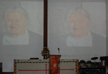 The late Prof Macpherson's smiling picture greeted celebrants