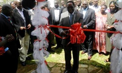 The Vice Chancellor, Prof. John Ddumba-Ssentamu cuts the tape to mark the FHRDC launch on 14th September 2012 at the Kasangati Health Centre, Wakiso Uganda.