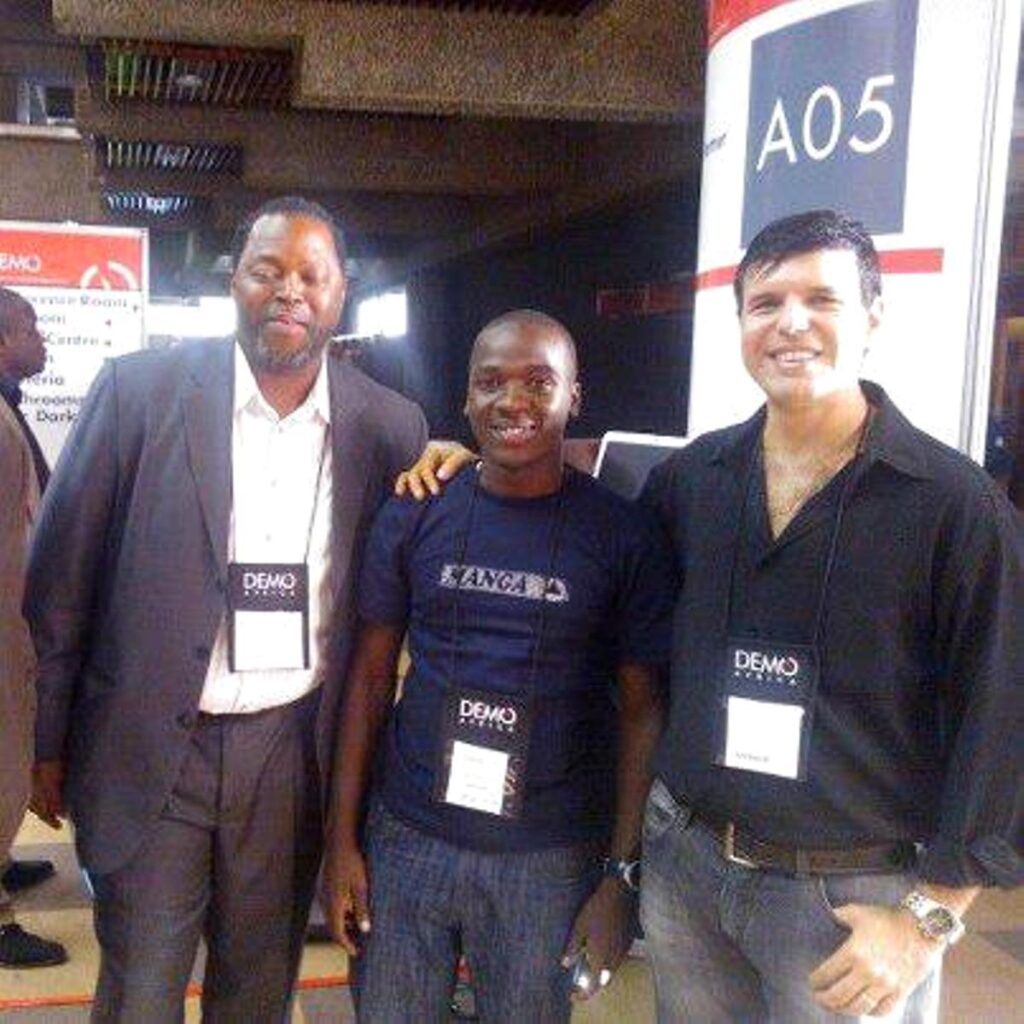 WinSenga Pitches at DEMO Africa 2012 in Nairobi: Josiah Kavuma (Centre) with part of the Microsoft Team @ Demo Africa 2012 in Nairobi — Vincent Delle-Microsoft EA (Left) and Amintas-Microsoft Imagine Cup (Right).