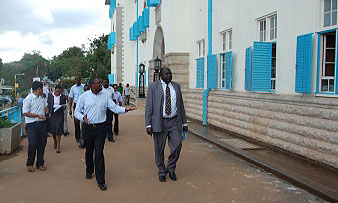 Prof. R. Ikoja Odongo(R) is led by Mr. Fred Nuwagaba(L) to inspect the Main Building before its handover on 5th December 2012, Makerere University, Kampala Uganda