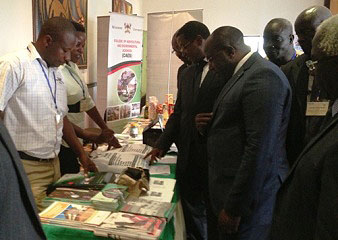 The Prime Minister of Rwanda Rt. Hon. Pierre Damien Habumuremyi (2nd R) inspects the Makerere Stall at the 9th RUFORUM AGM, 19-21 Sept 2013 Kigali Rwanda