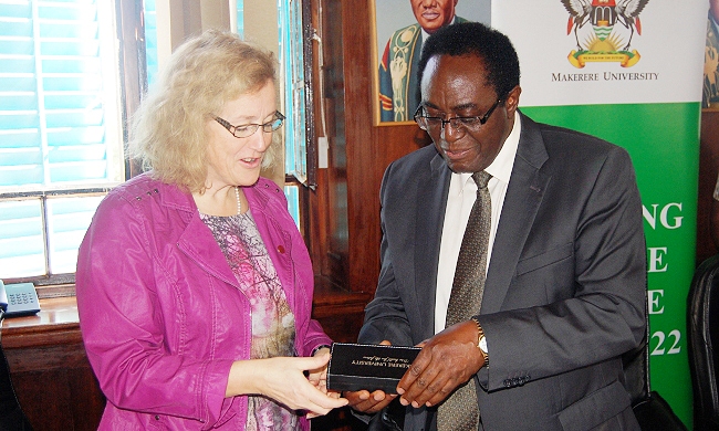 Makerere Vice Chancellor Prof. John Ddumba-Ssentamu hands over a Mak Pen to Uppsala Vice Chancellor Prof. Eva Akesson during the dialogue, 29th November 2013, Makerere University, Kampala Uganda