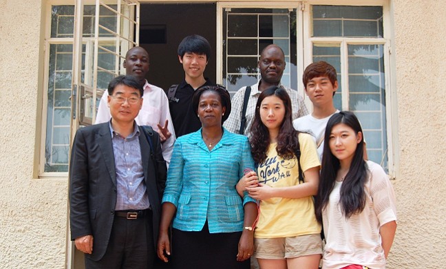 Prof. Kim Won Duck (L), Ms. Martha Muwanguzi (2nd L) with some of the exchange students including Mr. Mabudo (2nd R-rear) at the International Office on 6th Jan 2013, Makerere University, Kampala Uganda