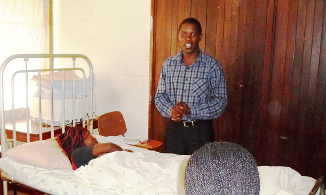 Mr. Louis Kakinda, a certified QHHT practitioner and  assistant lecturer in the College of Education and External Studies conducts the QHHT session at CGC, Makerere University, Kampala Uganda