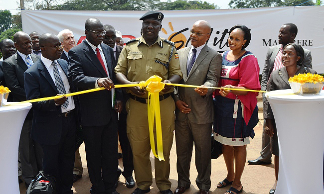 L-R: Dr. Tanga Odoi, DVCFA-Prof. Barnabas Nawangwe, Dir EWD-Mr. Fred Nuwagaba, Chair MUASA-Dr. Kiggundu Musoke, SOL Founder-Mr. Alan Hurst, DVCAA-Dr. Ernest Okello Ogwang, Guild President-H.E. Ivan Bwowe, Makerere Imam-Iddi Kasozi, Chief Guest-ACP Fred Enanga, MD SHARP-Mr. Patrick Katto, Mrs. Rosette Katto, Chair Convocation-Mr. Bruce Kabaasa, CEDAT Dep. Principal Dr. Venny Nakazibwe at the So-Lite Project Launch, 27th June 2014, Makerere University, Kampala Uganda