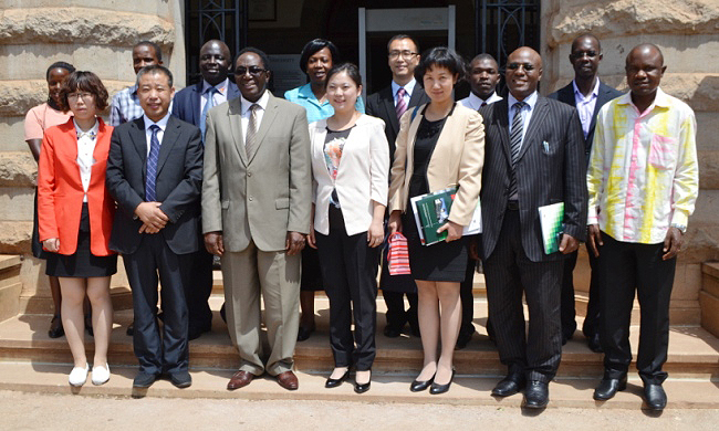 Vice Chancellor Prof. J. Ddumba-Ssentamu (3rd L), Mr. Chen Yongqing-SAU (2nd L), Prof. Shi Liju-Liaoning Shihua University (4th L), Prof. Xing Yuanyuan-Liaoning University (3rd R), Mr. Goddy Muhumuza (2nd L), Dr. Eria Hisali-CoBAMS (R), Rear: Dr. C. Okello Obura-CoCIS (3rd L), Ms. Martha Muwanguzi (4th L), Dr. Richard Ssekibuule (R) after the MoU signings, 4th July 2014, Makerere University, Kampala UgandaL