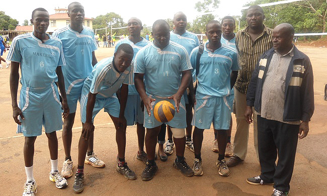R-L: Dr. Chris Bakuneeta, Makerere Volleyball Coach-Mr. Kawooya Eric with Members of the Men's Volleyball Team during the Institutional Title held 21st to 22nd June 2014 at Nkumba University, Wakiso Uganda