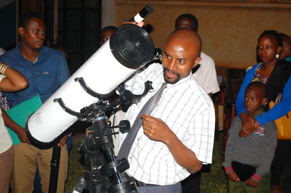 Twinamasiko adjusting the telescope