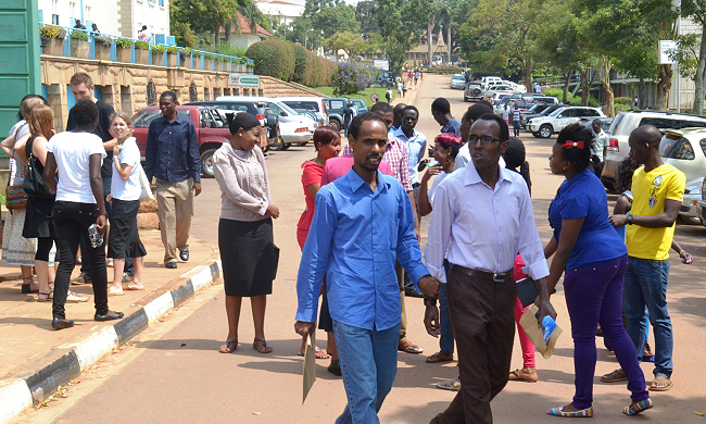 International Students cross the University Road after meeting Makerere Leadership on 28th August 2014, Makerere University, Kampala Uganda