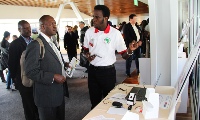 Faculty, Prof Lynn Atuyambe-School of Public Health (front) flanked by the Makerere University DVC- Prof. Barnabas Nawangwe in the Innovation Marketplace at TechCon2014