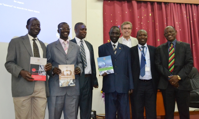 R-L: DVCFA-Prof. Barnabas Nawangwe, Mr. Godfrey Ssemugooma-Commissioner, MoFPED, Larry Ribbeklint-KPMG, Director Quality Assurance-Dr. Vincent Ssembatya (3rd L) and representatives from Finance, Procurement and Internal Audit Units of Makerere at the 3rd Dec 2014 Manuals' Launch, Makerere University, Kampala Uganda