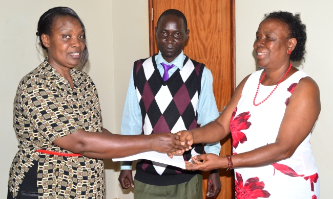 Deputy University Librarian-Dr. Helen Byamugisha (L), Mr. Patrick Akonyet-Directorate of Internal Audit (C) and Prof. Maria Musoke (R) during the latter's handover on 20th January 2015, Main Library, Makerere University, Kampala Uganda