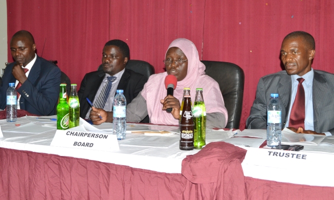 MURBS Board of Trustees Chairperson-Hajati Fatumah Nakatudde (2nd R) flanked by L-R: Administrator-Mr. Vitalis Omondi, Secretary-Dr. John Kitayimbwa and Trustee-Dr. Saul Nsubuga addresses the 4th AGM, 18th December 2014, Makerere University, Kampala Uganda