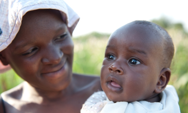 A young Ugandan Mother and her healthy baby. Photo by Chris Allan 2010