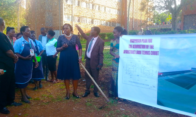 Member of Parliament for Bujenje Constituency, Princess Labwoni Kabakumba Masiko, holding a hoe at the launch of the fundraising.