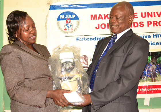 Dr. Jennifer Namusobya, Director MJAP hands over part of the equipment to Prof. Barnabas Nawangwe at the function.