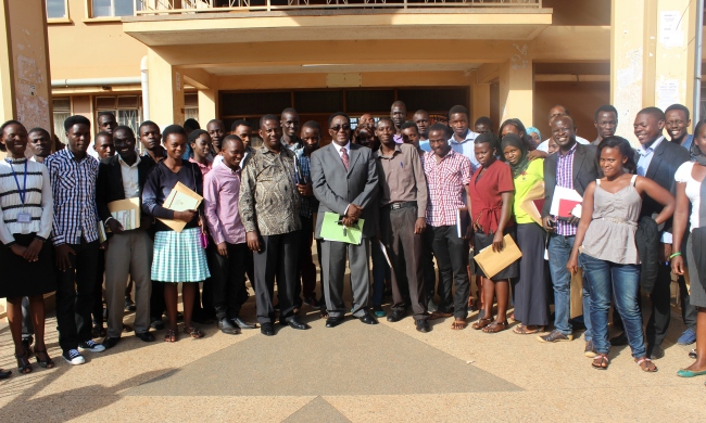 The Vice Chancellor, Prof. John Ddumba-Ssentamu (C) flanked by the Dean of Students, Mr. Cyriaco Kabagambe (to his right) and Staff poses with the 2nd Cohort of MasterCard Foundation Scholarship recipients after the Award Ceremony, 12th September 2015, Senate Building, Makerere University, Kampala Uganda