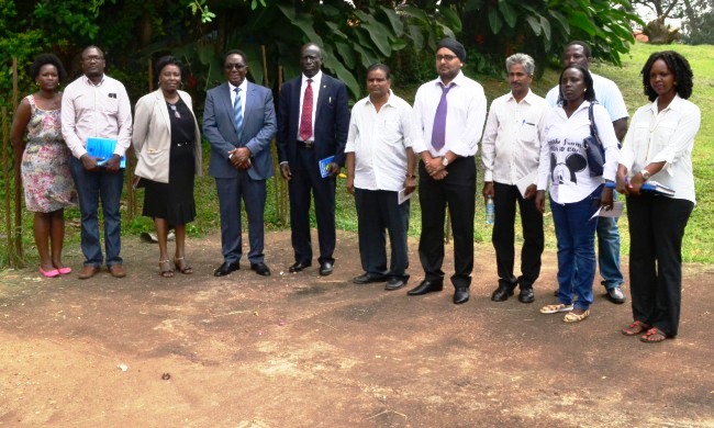 Mr. Robert Odok Oceng-Commissioner for Higher Education and Training (5th L), Vice Chancellor-Prof. John Ddumba-Ssentamu (4th L), Director PDD-Dr. Florence Nakayiwa (3rd L), Director EWD-Eng. Fred Nuwagaba (2nd L) with Excel Construction Officials and PDD Staff at the Site Handover Ceremony on 18th December 2015, School of Social Sciences, Makerere University, Kampala Uganda