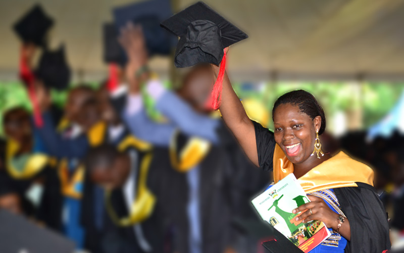A graduand celebrating after conferring a degree on her at the 65th Graduation of Makerere University in January 2016.