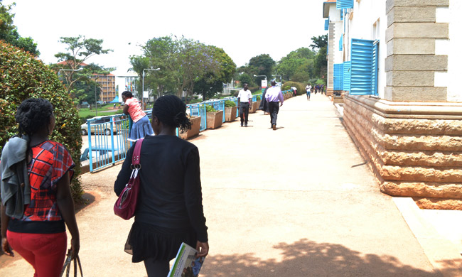 Students approach Main Building, Makerere University. Picture taken 28th August 2014.