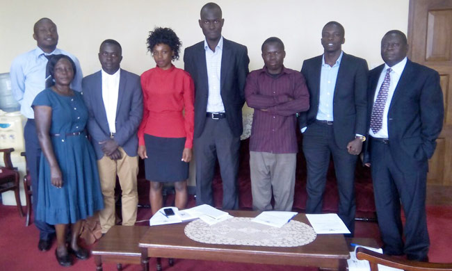 The newly Makerere University Students’ Electoral Commission together with the Deputy Dean of Students of Makerere University, Mr. Stephen Kateega and some of the members of the Caretaker Guild Government.