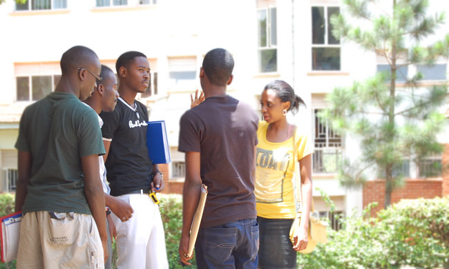Students standing near the Makerere University Main Library. Photo taken on 13th September 2015.