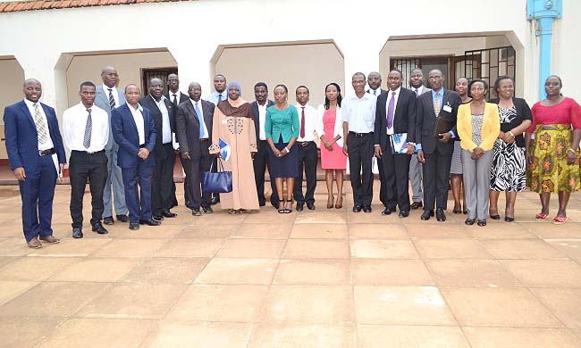 Chairperson and Secretary MURBS Board of Trustees-Hajati Fatumah Nakatudde and Dr. John Kitayimbwa (Centre) flanked by MURBS Staff, Trustees, and representatives of the Scheme Administrator, Fund Managers, Custodian, Bankers and Auditors after the 6th AGM, 27th October 2016, Main Hall, Makerere University, Kampala Uganda