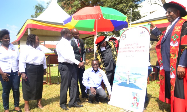 R-L: The Prime Minister-Rt. Hon. Dr. Ruhakana Rugunda, Chancellor-Prof. Ezra Suruma, Dr. Deus K. Muhwezi (squatting), Guild President-H.E. Roy Ssemboga, Chairperson Convocation-Dr. Tanga Odoi, Vice Chairperson-Nyago Diana at the Perimeter Wall Fundraising Drive, 21st February 2017, Freedom Square, Makerere University, Kampala, Uganda