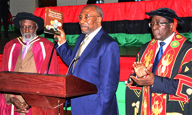 Prime Minister Rt. Hon. Dr. Ruhakana Rugunda (centre) officially launching the book, on his right is Prof. James Patrick Manyenye Ntozi and left is Vice Chancellor Prof. John Ddumba-Ssentamu