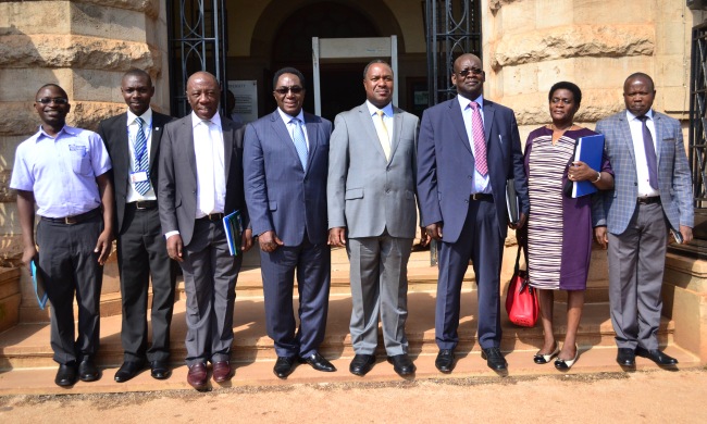 Hon. Dr. Elioda Tumwesigye (4th R), flanked by the VC-Prof. John Ddumba-Ssentamu (4th L), Mr. David O. O. Obong (3rd R), Principal CEDAT-Dr. Henry Alinaitwe (3rd L) and Ministry of STI officials during visit, 4th April 2017, Makerere University, Kampala Uganda