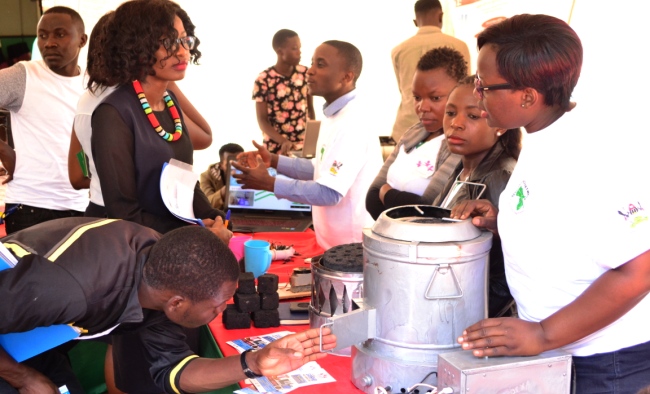 Participants inspect energy-efficient innovations during the ResilientAfrica Network (RAN) Exhibition, 6th April 2017, Makerere University, Kampala Uganda