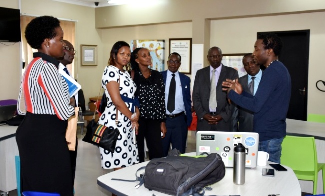The Delegation from Mount Kenya University interacts with an innovator during their visit to the RAN Innovation Lab on 24th April 2017, RAN Kololo Offices, MakSPH, Makerere University, Kampala Uganda. Left is RAN Communication Manager-Ms. Harriet Adong