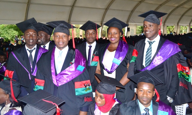 Graduands from the School of Law stand to receive their awards on Day4 of the 67th Graduation Ceremony, 24th February 2017, Freedom Square, Makerere University, Kampala Uganda