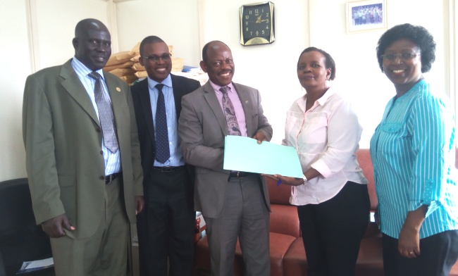 L-R: Ag. Dir. Internal Audit-Mr. Benson Barigye, Mr. Godwin Okiror-HRD, DVCFA-Prof. Barnabas Nawangwe, Outgoing Dir. HR-Mrs. Mary K. Tizikara and Ag. Dir. HR-Mrs. Dorothy Sennoga-Zake at the handover, 4th July 2017, Makerere University, Kampala Uganda