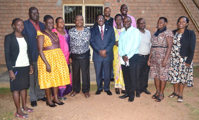 Vice Chancellor-Prof. John Ddumba-Ssentamu (C) flanked by Mr. and Mrs. Mayanja, Ag. Dir. Internal Audit-Mr. Benson Barigye, staff and guests at the celebration in honour of Mr. Mayanja, 30th June 2017, Guest House, Makerere University, Kampala Uganda