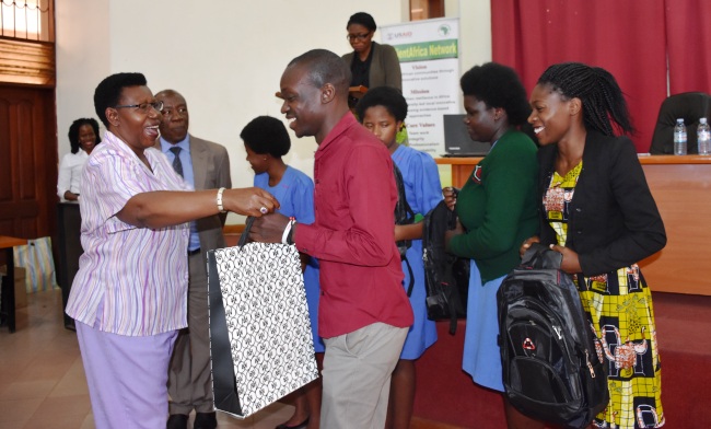 Chief Guest at the National Technovation Challenge Finals, Hon. Dr. Miria Matembe-Founder Member CEWIGO (L) flanked by Prof. Henry Alinaitwe-Principal CEDAT (2nd L) hands over prizes to one of the finalist teams, 21st July 2017, CEDAT Conference Hall, Makerere University, Kampala Uganda