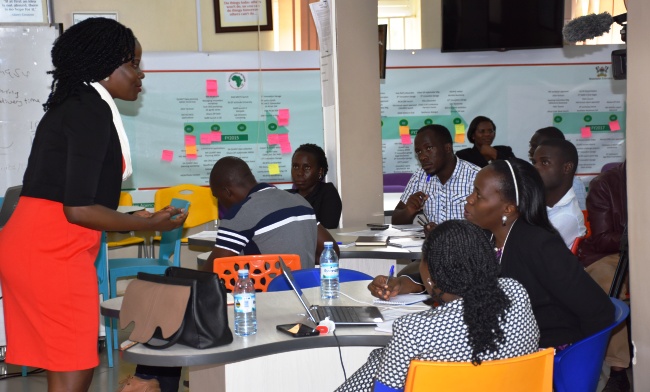 RIAP 2 Awardees listen to Ms. Harriet Adong-RAN's Communication Manager during the Induction Session, 13th-14th July 2017, RAN Kololo Offices, MakSPH, Makerere University, Kampala Uganda