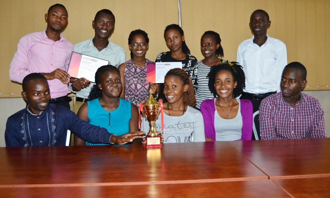 The Team of 3rd Year B.COM Students that emerged 2nd Runners Up in the Insurance Quiz pose with their trophy in the Boardroom, 23rd October 2017, School of Business, CoBAMS, Makerere University, Kampala Uganda. Ms. Ankunda Nisa (Front: 3rd L) won herself a scholarship from IIU.