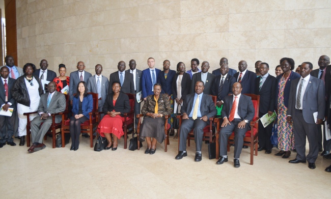 First Lady-Hon. Janet Kataaha Museven (Seated 3rd R), Hon. Dr. Elioda Tumwesigye (Seated 2nd R), Hon. Rosemary Sseninde (Seated 3rd L), DVCFA-Prof. William Bazeyo (R), Prof. Mukadasi Buyinza (3rd R) with World Bank Officials, Vice Chancellors and Government Officials during the launch of ACE projects, 15th November 2017, Kampala Uganda