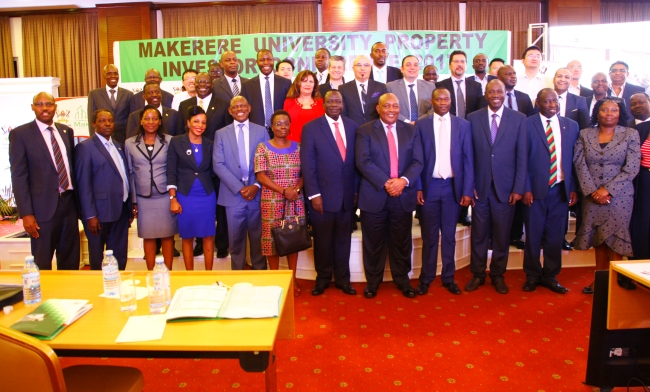 Chair Council-Eng. Dr. Charles Wana-Etyem (6th R) flanked by Deputy Chair-Hon. Irene Ovonji-Odida (6th L), Mak Holdings Board Chair-Mr. Charles Mbire (5th R), Vice Chancellor-Prof. Barnabas Nawangwe (5th L), Members of Management, Mak Holdings Board, partners and prospective Investors during the Investor Conference, 5th December 2017, Kampala Serena Hotel.