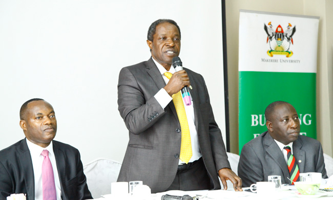 Acting Deputy Vice Chancellor (Finance and Administration)-Prof. William Bazeyo(Centre) speaking at the Training. On his left is the Chairperson Board of Trustees, SAIU-H.E. King Caesar Augustus Mulenga  and the Principal, College of Health Sciences - Dr Charles Ibingira (R)