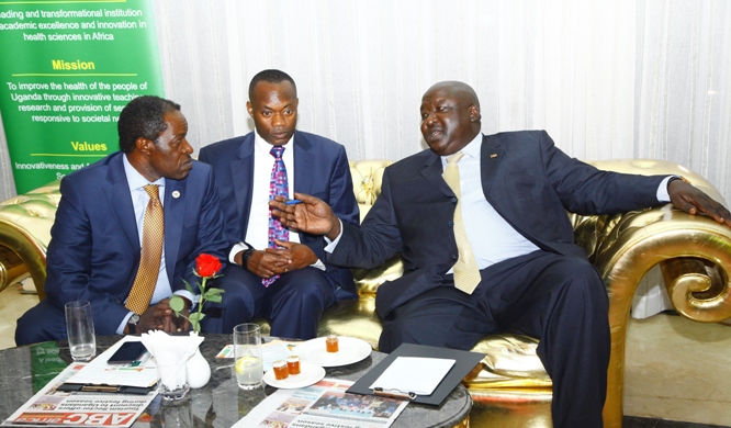 R-L, Chief Guest, State Minister for International Affairs-Hon. Henry Oryem Okello (C),the Chairman of St Augustine International University H.E King Caesar Augustus Mulenga and Makerere University Acting Deputy Vice Chancellor for Finance and Administration Prof. William Bazeyo.