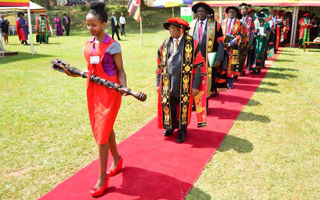 The Chancellor-Prof. Ezra Suruma (2nd L) followed by Chair Council-Eng. Dr. Charles Wana-Etyem, Vice Chancellor-Prof. Barnabas Nawangwe, Academic Registrar-Mr. Alfred Masikye Namoah and other members of Management leads the procession out of the Freedom Square after the second session of the 68th Graduation, 17th January 2018, Makerere University, Kampala Uganda. Mr. Mwetware Crescent was on the same day recognized by ACCA Uganda as the best BCOM (Accounting Option) student.