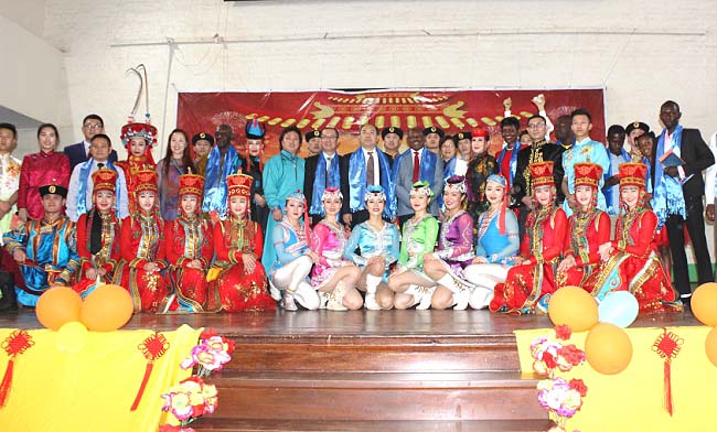 Chinese Ambassador to Uganda-H.E Zheng Zhuqiang and Vice Chancellor-Prof. Barnabas Nawangwe (Centre) surrounded by Members of Staff, Family and performers after the Chinese New Year Show held in the Main Hall, 11th February 2018. The show was presented by the Inner Mongolia Bureau of National Art Troupe from China.