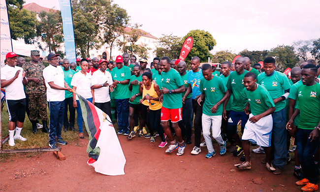 The Katikkiro of Buganda Owek. Charles Peter Mayiga flags off the 15km race of MakRun 2018 as L-R: Prof. Barnabas Nawangwe, Hon. Florence Nakiwala Kiyingi, Prof. William Bazeyo and AIGP Andrew Sorowen applaud on 25th March 2018, Freedom Square, Makerere University, Kampala Uganda. Runners took part in 5, 10 and 15km races aimed at raising funds for the construction of a Students Centre.