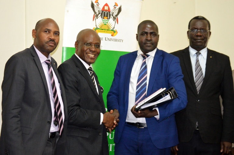 L-R,Makerere University Secretary Mr. Charles Barugahare,the outgoing Acting Director of Makerere University Directorate of Legal Affairs Canon Goddy Muhanguzi Muhumuza, the newly appointed substantive Director Mr. Henry Mwebe and the Director of Internal Audit  Mr. Walter Yorac Nono.