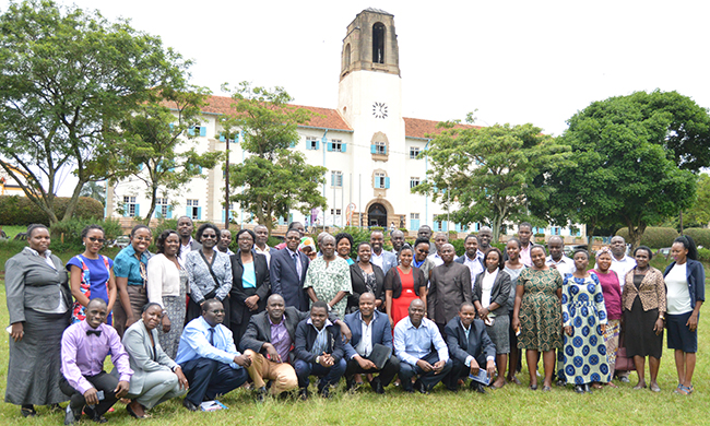 Mak Phd Fellows in a group photo with the Prof. Buyinza Mukadasi Director, Directorate of Research and Graduate Training